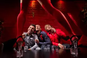 A group of guys celebrating a bachelor party at Centerfolds Strip Club.